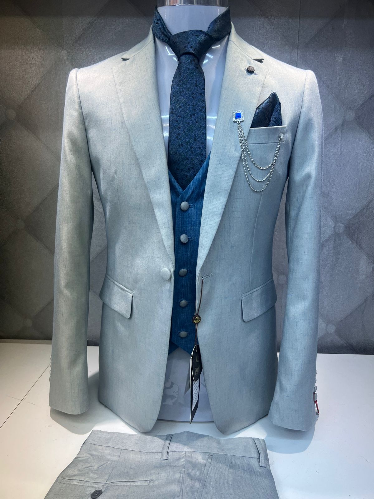 Light Grey Three-Piece Suit with Blue Accents